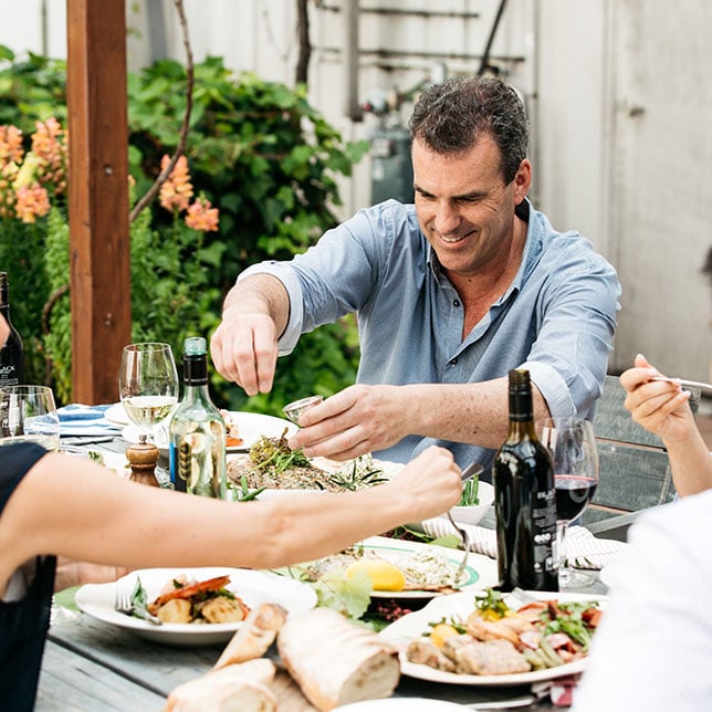 Gathering with assorted food and wine