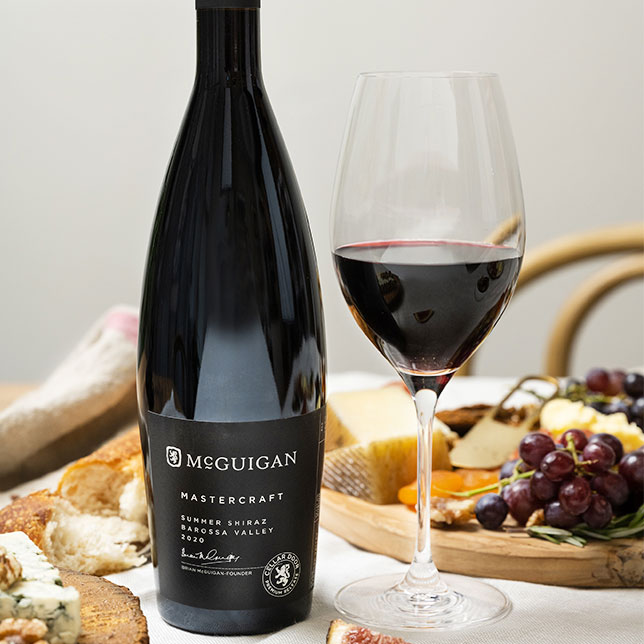 McGuigan Mastercraft Summer Shiraz with charcuterie board containing fruit and cheese