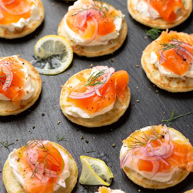 Smoked salmon and brie on a small pancake 