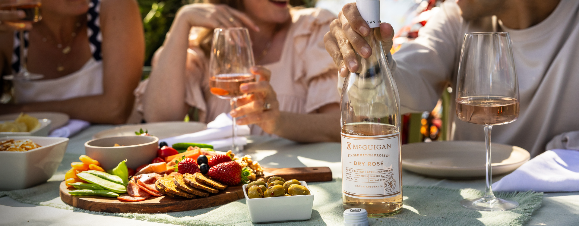 Summer table outside with single batch mcguigan rose wine