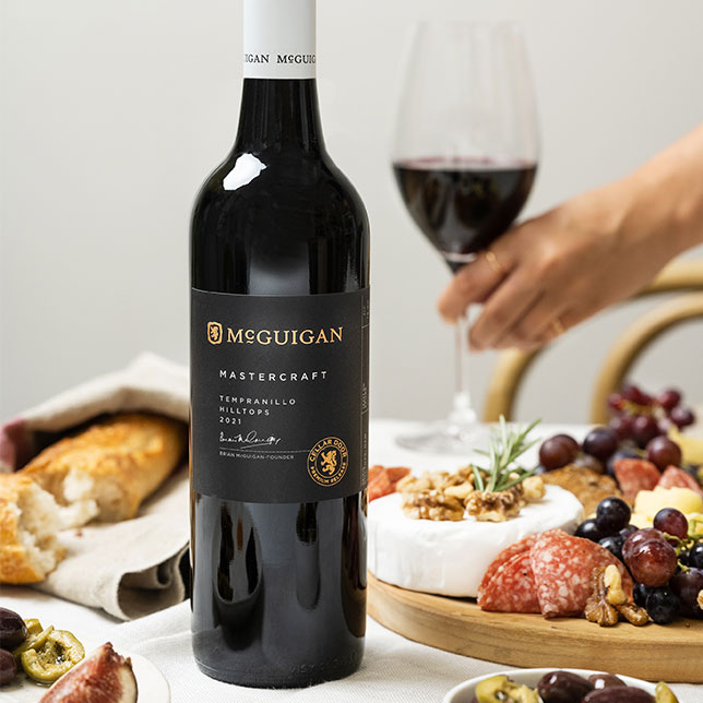 McGuigan Mastercraft Tempranillo with charcuterie board containing cheeses, meats and crackers