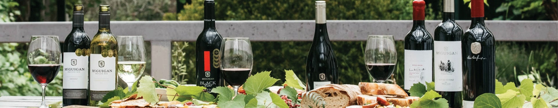 McGuigan Wines collections on a table in outdoor setting with food
