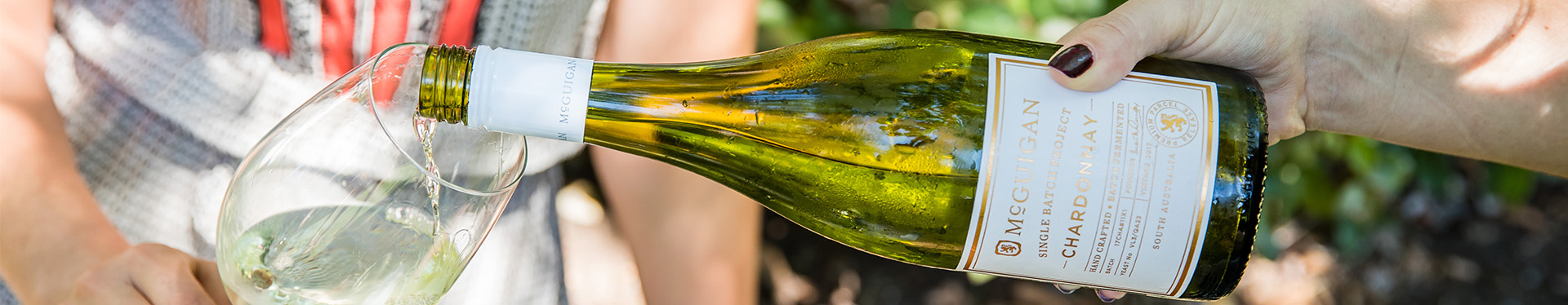 wine bottle pouring into wine glass